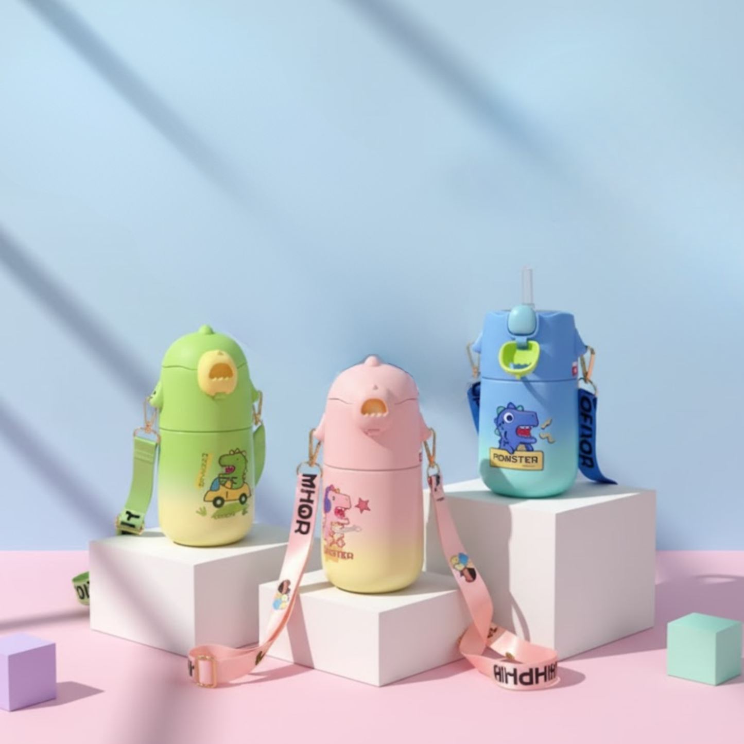Cute kids thermos bottles with straps in fun animal designs made from SS316 steel, leak-proof, straw and spout, displayed on pastel blocks