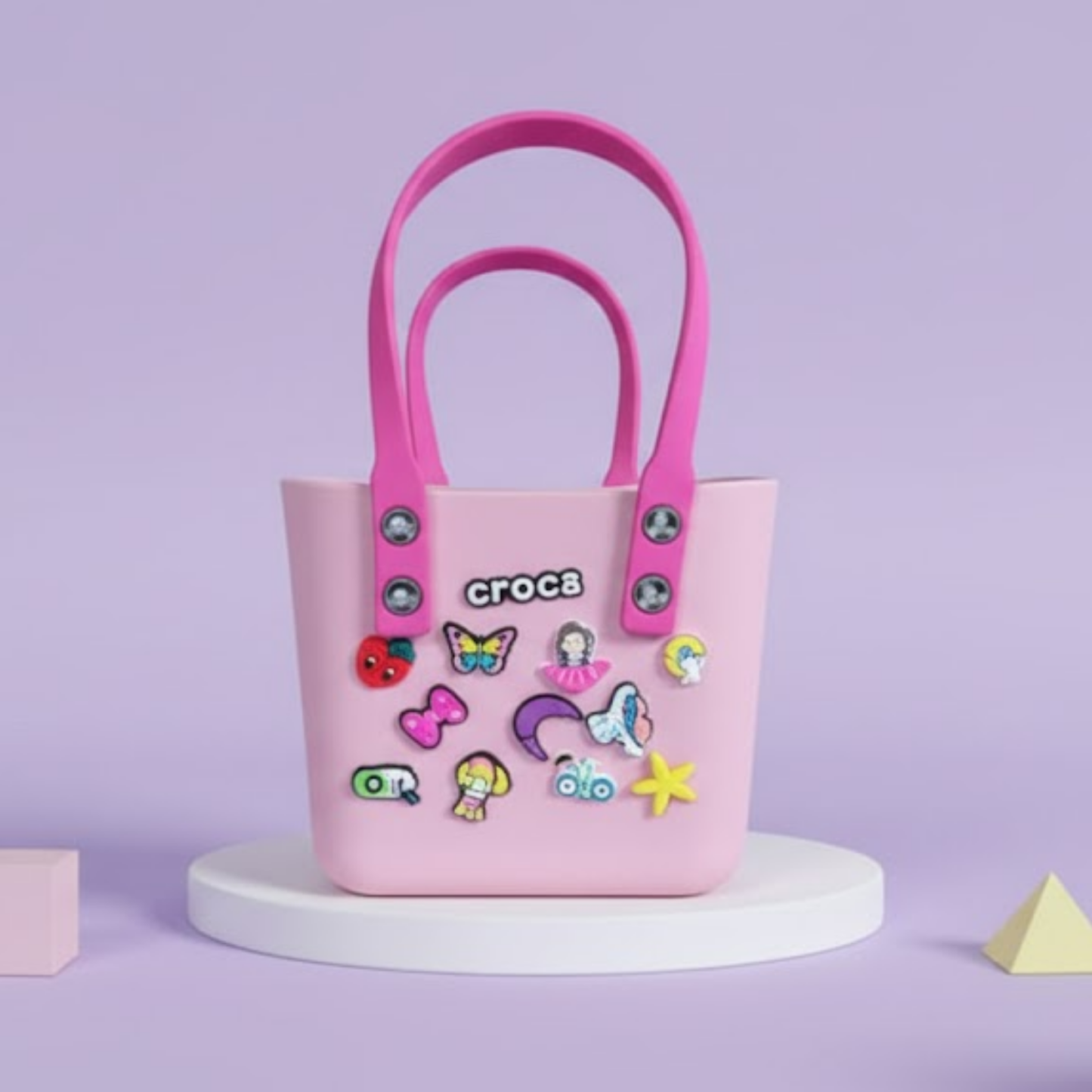 kids Crocs tote bag with cute removable cartoon charms and blue handles displayed 