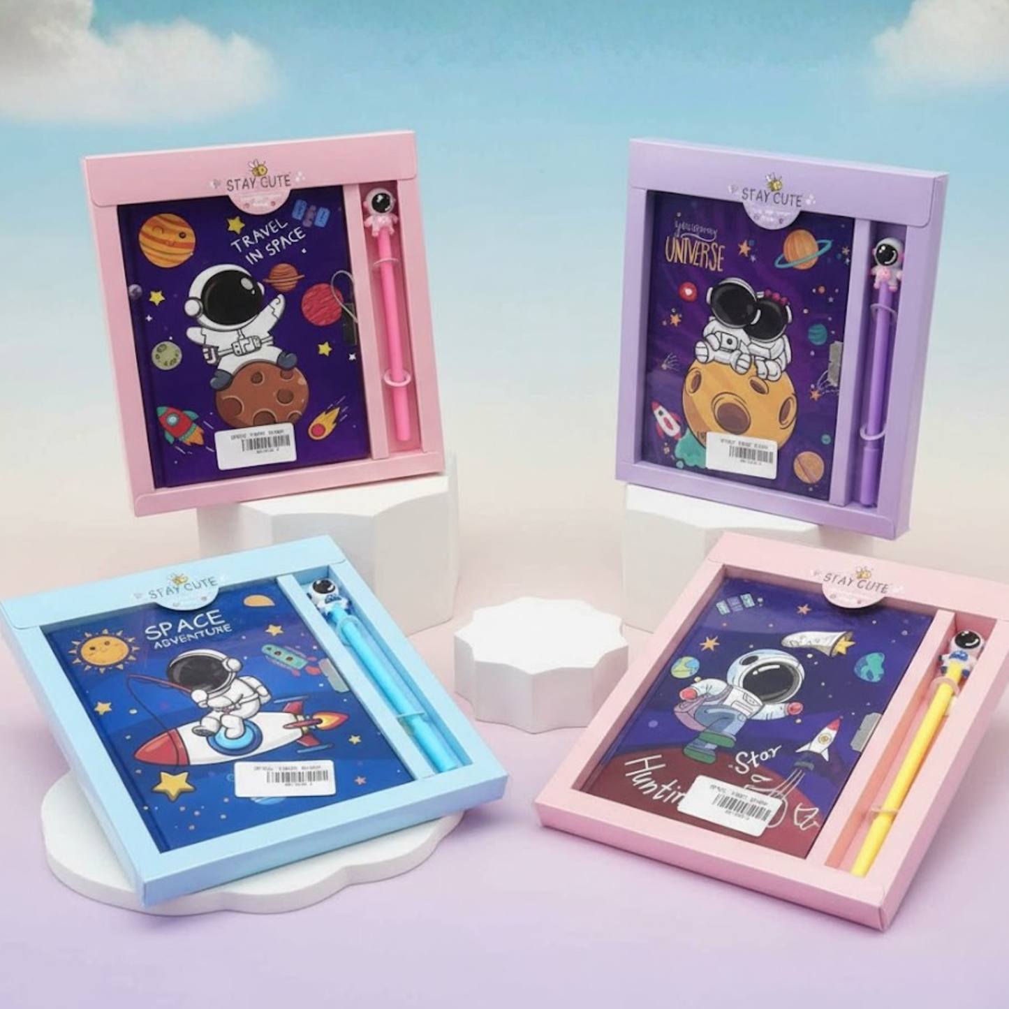 Kids astronaut-themed stationery gift sets with colorful space diaries and matching pens.