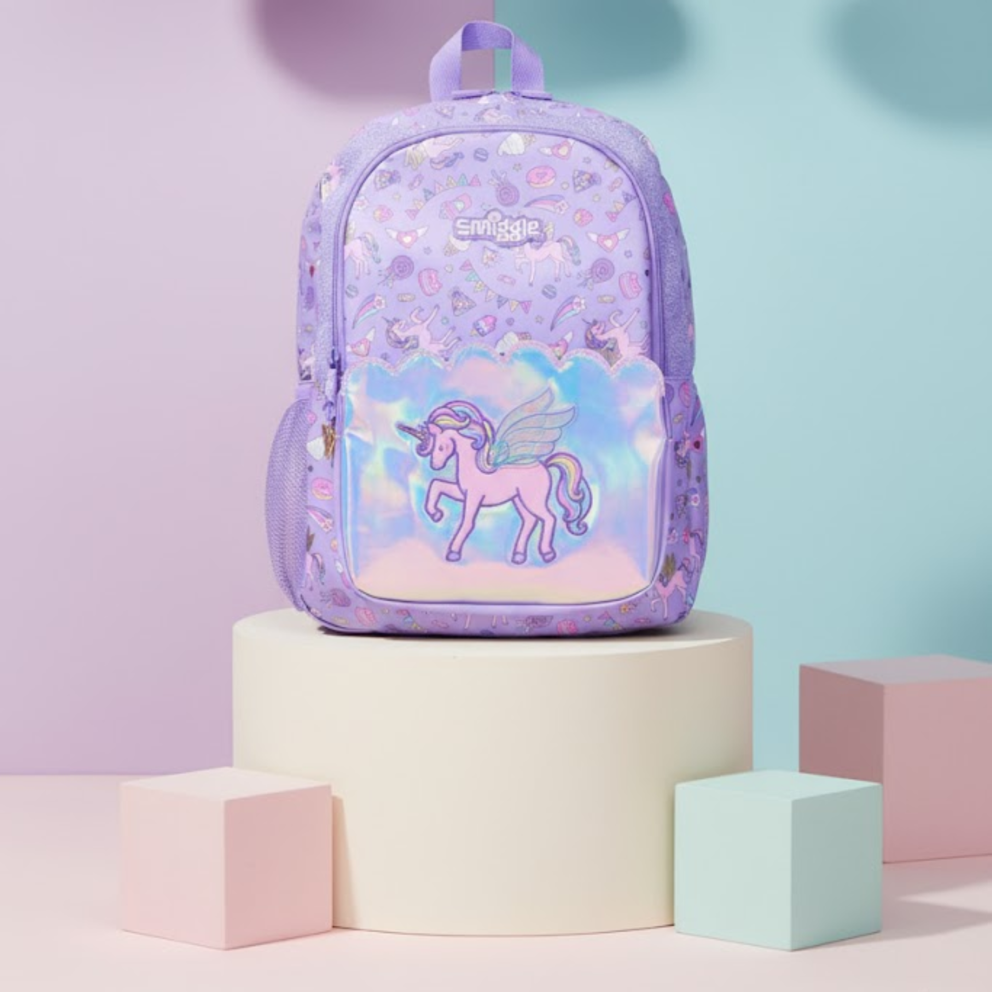 Unicorn theme girls school bag in pastel purple with holographic pocket and side mesh pouch.